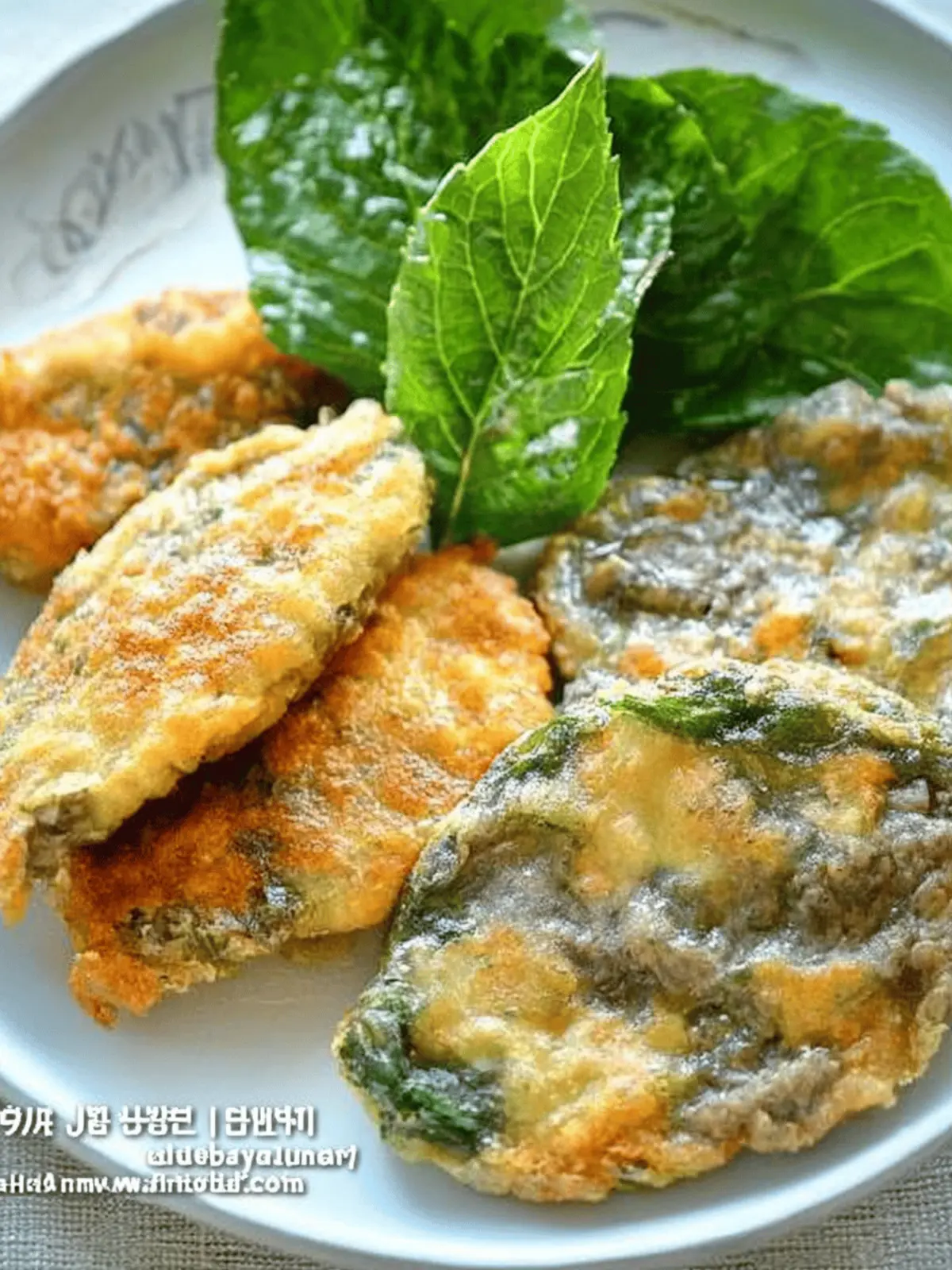 Delicious Wanja Jeon and Kkaennip Jeon: Savory Beef Treats 2 Pan-Fried Beef Patties (Wanja Jeon) and Stuffed Perilla Leaves (Kkaennip Jeon)